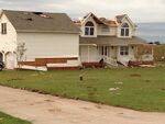 EF1 damage example-- A majority of the house's roof was blown away, some siding was torn away, and the roof's shingles were blown off or loosened.