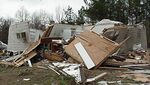 F2 damage to a mobile home on January 3, 2000 in Missisippi. In contrast to a regular well-constructed house - which still suffers severe damage at F2 strength - mobile homes are often destroyed or heavily damaged. This mobile home has had the walls detached.